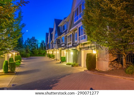 Townhouses, homes, community at  dusk, night time in suburbs of Vancouver, Canada.