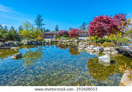 Nicely decorated and designed pond in the great neighborhood of Vancouver, Canada. Landscape design.