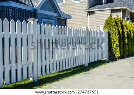 County style wooden fence separate and protect private property.