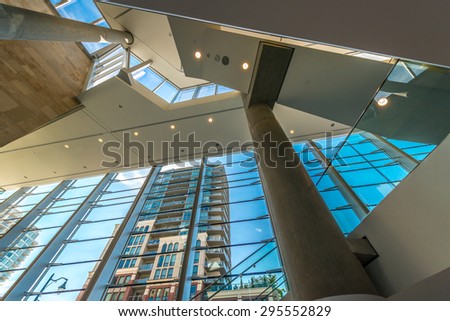 Staircase painted in red. Abstract fragment of urban architecture of modern luxury building, center, hotel, shopping mall, business centre.   Interior design. Vertical.
