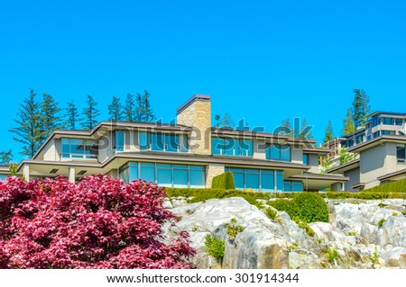 Great neighborhood with custom made luxury modern houses on the rocks with nicely landscaped front yards  in the suburbs of Vancouver, Canada.