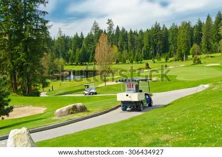 Golf carts and a service cart at the beautiful  golf course. Vancouver, Canada.
