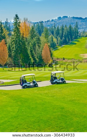 Golf carts at the beautiful  golf course.  Vancouver, Canada. Vertical.