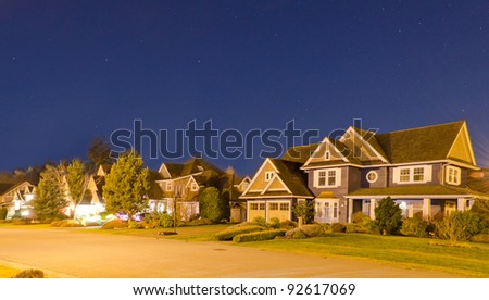 Great neighborhood at the night time. The suburb houses at sunrise-sunset night time.