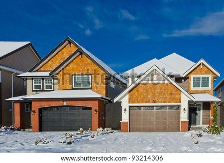 Nice neighborhood. The homes covered with snow. Winter  in suburbs of the north America. Vancouver.