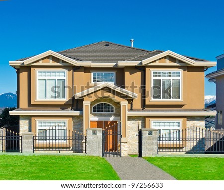 Big comfortable house with dark blue sky as a background