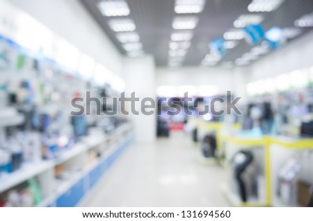 Defocused background of real shopping mall, gadget store.
