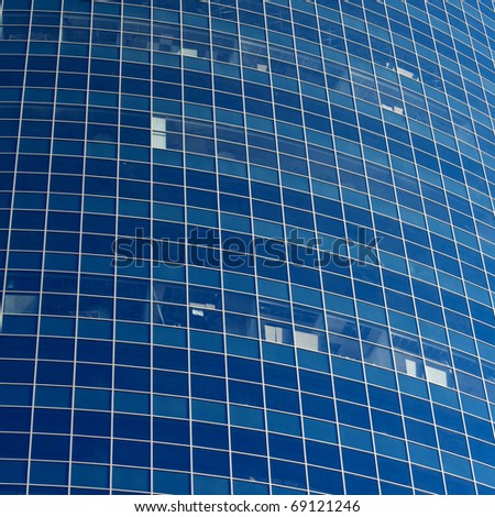 windows on a modern office building making a background pattern effect