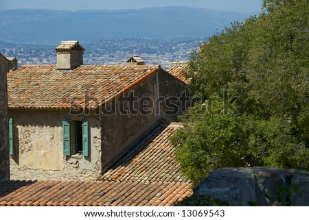 A lovely villa with a red terrocotta roof overlooks the French countryside