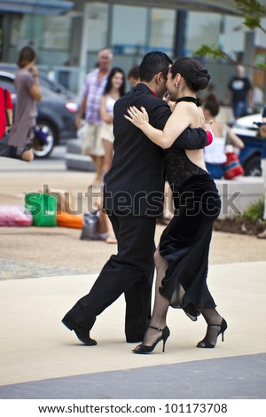 GOLD COAST - AUSTRALIA - 18 MARCH: Unidentified  pair dancing tango on Japan & Friends Day  festival.  18 March 2012 on Gold Coast,  Australia.  Street dancers performing tango