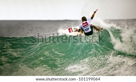 SNAPPER ROCKS, GOLD COAST, AUSTRALIA - FEB 26: Unidentified Surfer races the Quiksilver & Roxy Pro World Title Event. February 26, 2012, Snapper Rocks, Gold Coast, Australia