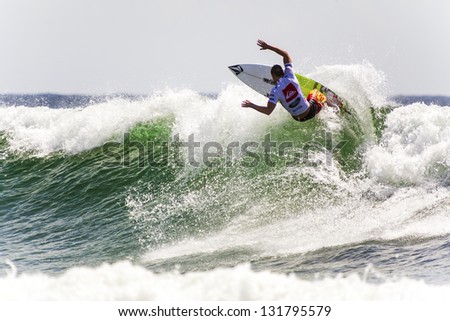 SNAPPER ROCKS, GOLD COAST, AUSTRALIA - 9 MARCH: Unidentified Surfer races the Quiksilver & Roxy Pro World Title Event. 9 March 2013, Snapper Rocks, Gold Coast, Australia