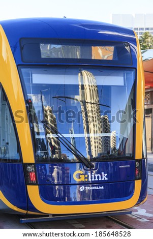 GOLD COAST AUSTRALIA - April 5: Brand new light rail on test run (not yet open for the public), under commissioning at Surfers Paradise with some  reflection on April 5, 2014 Australia