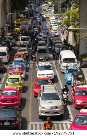 BANGKOK APRIL 27: Traffic moves slowly along a busy road in Sathorn district on April 27 2014 in Thailand. Annually an estimated 150,000 new cars join the heavily congested roads of Bangkok.