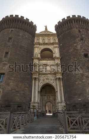 NAPLES, ITALY, MAY 22, 2014: The medieval castle of Maschio Angioino or Castle Nuovo (New Castle), Naples, Italy.  The castle built at the port to protect the city, now serve as a museum.