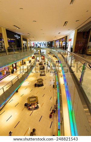 DUBAI, UAE - 5 JUN 2014: People walking in Mall of the Emirates in Dubai, UAE. Mall of the Emirates is multi-level shopping center with over 700 stores. The largest shopping mall by are in the world.