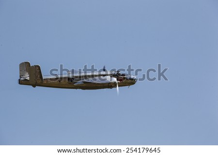 BUDAPEST, HUNGARY - MAY 1: B-25 Mitchell historic bomber plane fly-by with Red Bull marking on it\'s fuselage on May1, 2014 in Hungary