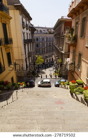 NAPLES, ITALY - MAY 22, 2014: Classical romantic small street in the historical center of Naples, Italy. Naples is the the third-largest city in Italy with about 1 million residents