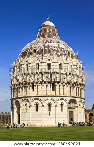 PISA ITALY - MAY 20 2014. Many statues and logo decorates the newly renovated Dome Primaziale Pisana in front of the leaning tower in Pisa, on May 20, 2014. Square of Miracles is UNESCO heritage.