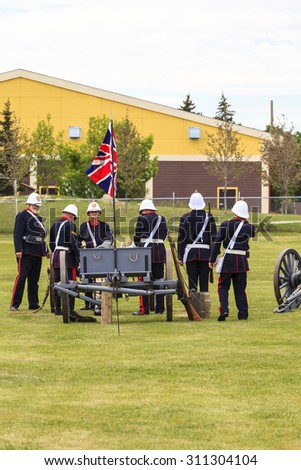 CALGARY, CANADA - JUN 13: Exhibits outside the Military Museums in Calgary, Alberta Canada. It is made of museums dedicated to representing Canada\'s navy, army, and air force. Soldiers with cannon.