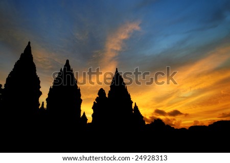 Hindu temple - Dramatic sky with sun setting at Hindu temple Prambanan. Indonesia, Central Java, Yogyakarta