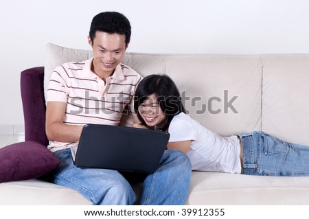 Internet fun. Couple sharing information from internet.