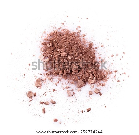 Scattered brown powder isolated on a white background. Makeup