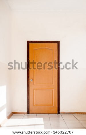 Closed door in empty hallway