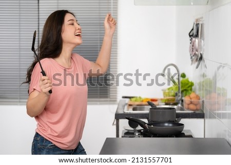 Similar – Image, Stock Photo Cheerful women dancing while listening to music