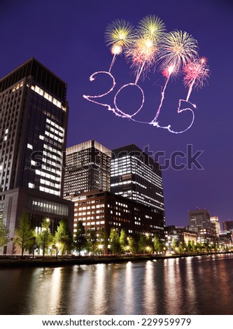 2015 New Year Fireworks celebrating over Tokyo cityscape at night, Japan
