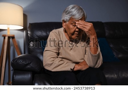 Similar – Image, Stock Photo Senior woman sitting alone on the sofa at home