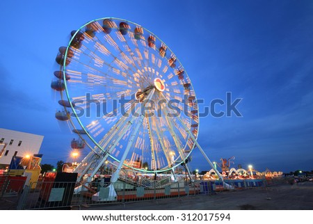 Ferris Wheel(motion) at amusement park at twilight time