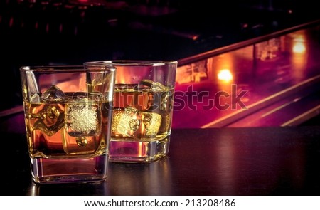 whiskey with ice on bar table lounge bar atmosphere