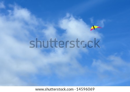 flying kite over blue sky and clouds background