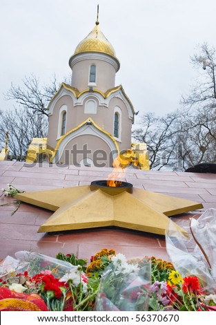 an eternal  fire  memorial in the vladivostok of russia against the Orthodox Church  chapel