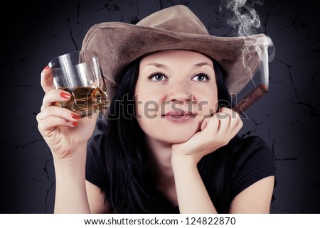 pretty girl the cowboy with a cigar and whiskey