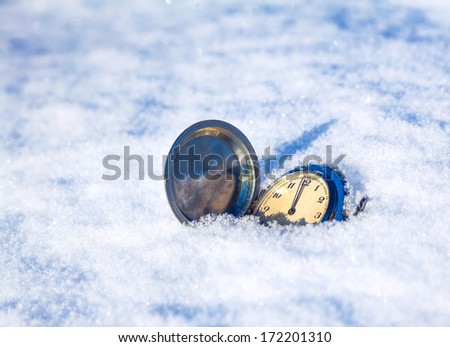 clock lying in the snow, Christmas background