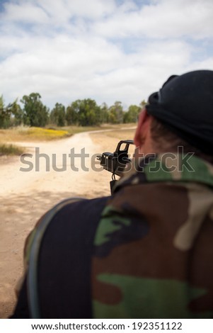 armed man with a gun is holding at gunpoint, the military conflict