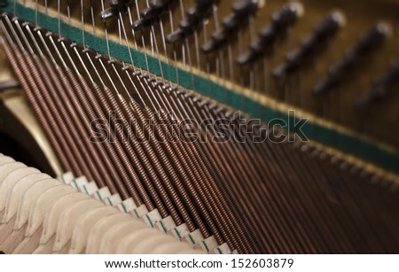 Piano strings and hammers close up