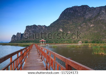 Wooden Bridge in lotus lake at khao samroiyod national park, thailand