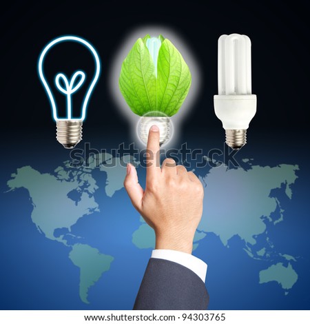 Business hand touch green light bulb concept of energy saving