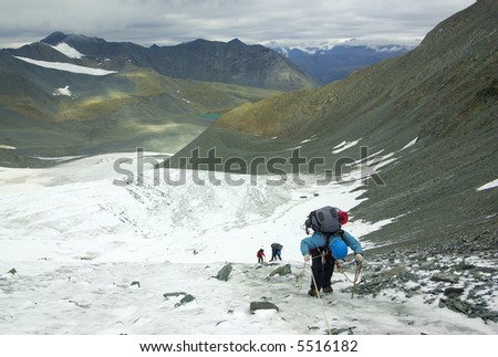 glacier climbers team and mountain landscape