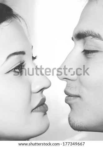 Sepia photo of  young man and woman face in a profile