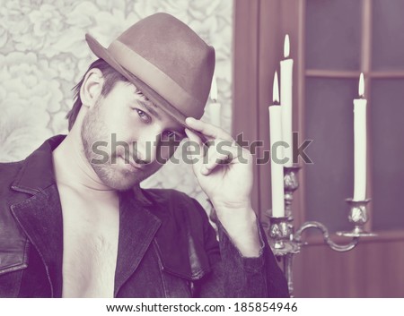 Retro portrait of a handsome retro style man in hat