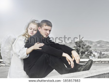 Vintage photo of angel woman embraces upset unfortunate man