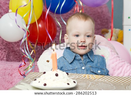 Little girl with her first  birthday cake