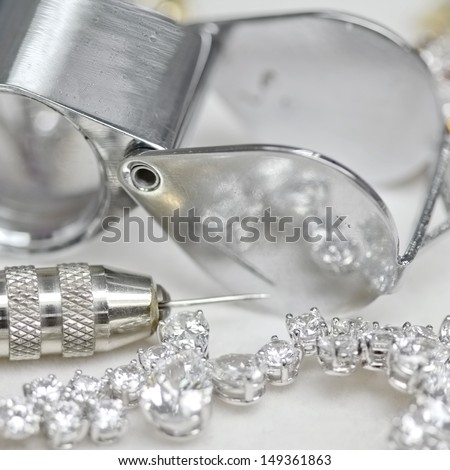 Bracelet with diamond and repairing jewelry tools (loupe,pliers)