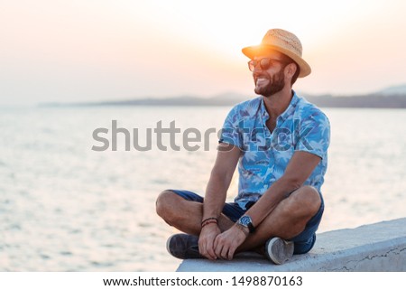 Similar – Foto Bild Mann genießt den Sonnenuntergang am Strand