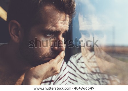 Similar – Image, Stock Photo Depressed man looking through window