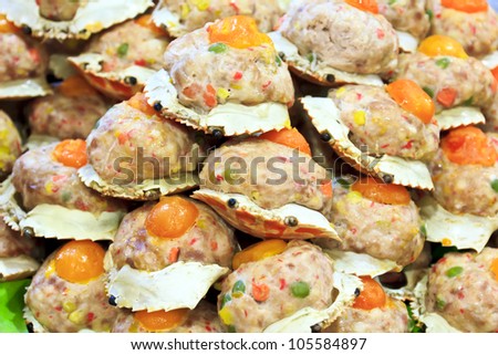 Steamed crab meat, pork and various ingredients stuffed shell topped with salted egg yolk.